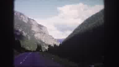 Colorado USA (1958): A Person Riding Down The Street Viewing The Mountains