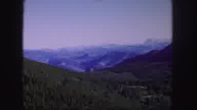 Colorado USA (1958): A Vast View Of A Green Valley With Mountains In The
