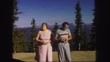 Colorado USA (1958): A Man And An Elderly Women Are Standing Near A Forest In The