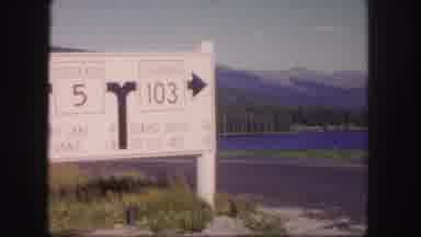 Colorado USA (1958): Black And White Road Sign At A Fork In A Road In Front Of A
