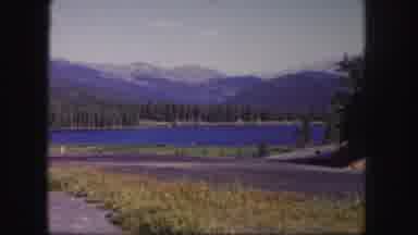 Colorado USA (1958): Sky Blue Lake Encircled By Dense Forest Of Green Trees With