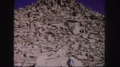 Colorado USA (1958): Woman And Man Standing Next To A Large Pile Of Rocks That