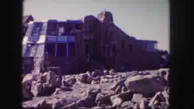 Colorado USA (1958): Old Stone Building In The Sand With People Searching For
