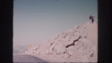 Colorado USA (1958): Two People Walk Down Rocky Path On A Bright Sunny Day