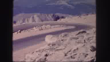 Colorado USA (1958): Old Car Driving Down A Curvy Mountain Road