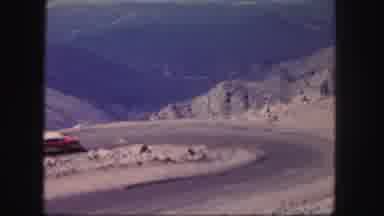 Colorado USA (1958): A Car Drives Around A Tight Bend On A Scenic Mountain Road