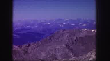 Colorado USA (1958): A Mountain Range Viewed From The Air And A Car On A Dirt
