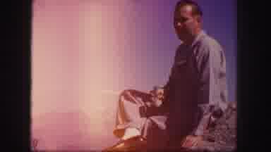 Colorado USA (1958): Man Sitting On Top Of A Cliff