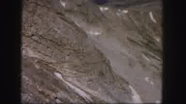 Colorado USA (1958): Overview Shot Of Bare Mountainous Terrain And A Small Lake Or