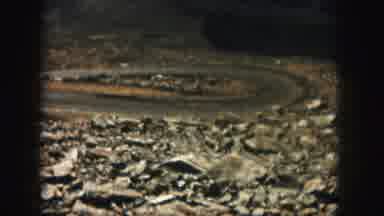Colorado USA (1958): A Small U-Shaped Road Traveling Around A Rocky Area With A
