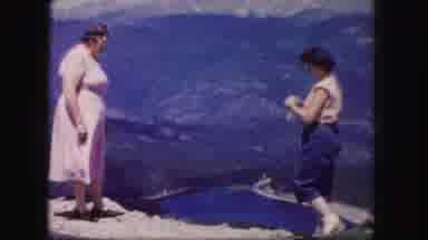 Colorado USA (1958): Two Women Sightseeing In A Valley With A Lake Surrounded By