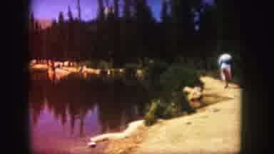 Colorado USA (1958): A Person Walking Down A Path Close To A Lake On A Beautiful
