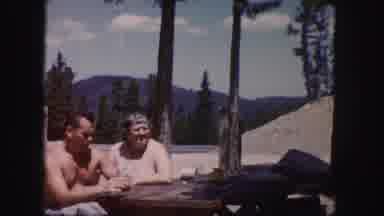 Colorado USA (1958): A Couple At A Table With Trees And A Scenic Mountain View In