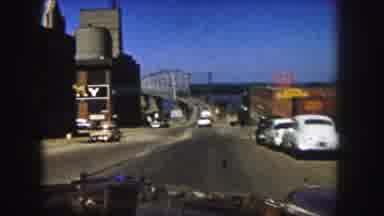 Denver Colorado (1958): Car Driving On A Bridge Located Over A Body Of Water