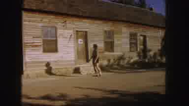 Denver Colorado (1958): Woman Strolls Outside The House On A Very Pleasant And