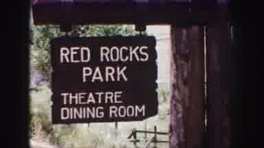 Denver Colorado (1958): A Wooden Hanging Sign That Reads Red Rocks Park Followed