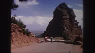 Denver Colorado (1958): People Walking On Dirt Road Towards Brown Rock Formation