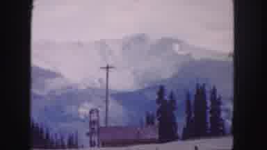 Denver Colorado (1958): A Man On A Cable Car Shifting On A Mountain With Snows To