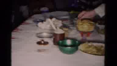 Hagerstown Maryland USA (1958): Woman Wearing White Shirt Eats Snack From A