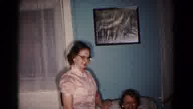 Hagerstown Maryland USA (1958): Woman Wearing Glasses Stands Next Woman Sitting In