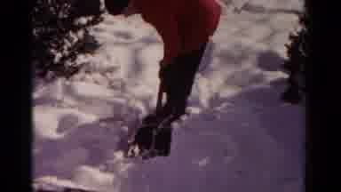 Hagerstown Maryland USA (1958): Person In Orange Jacket Attempts To Shovel Snow
