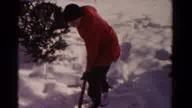 Hagerstown Maryland USA (1958): Boy In Red Coat Shovels Snow In The Cold Weather