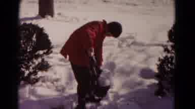 Hagerstown Maryland USA (1958): Young Man Red Coat Outside Shoveling Snow Then