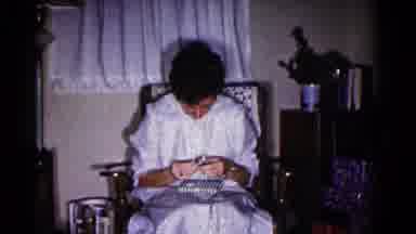 Hagerstown Maryland USA (1958): Woman And Boy Both Wearing Pajamas Sitting In