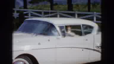 Las Vegas USA (1958): Woman Driving In Vintage Car Parks And Is Greeted By Dog