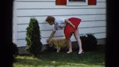 Las Vegas USA (1958): Woman Plays With Her Dog Outside Her Home On A Sunny And Hot