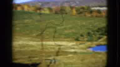Las Vegas USA (1958): View Of Green Farmland Pound And White Fence On A Sunny Day
