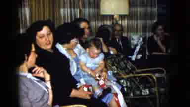 Las Vegas USA (1958): Woman Holds Baby Wearing Blue Shirt While Kids Play With