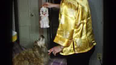Las Vegas USA (1958): A Man In A Golden Silk Shirt Plays With His Dog By Using A