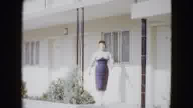 Las Vegas USA (1958): Woman In Tight-Fitting Dress Walks Away From A Hotel Room