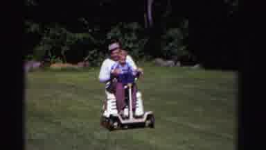 Ontario Canada (1958): Grandpa Riding His Grandson On His Scooter