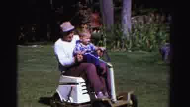 Ontario Canada (1958): Older Man Mowing A Lawn Using A Riding Lawn Mower With A