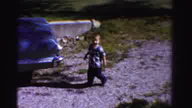 Ontario Canada (1958): Toddler Walks Outside In Driveway