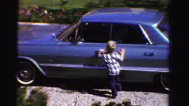 Ontario Canada (1958): Small Toddler In Blue Plaid Shirt Is Interested In The Blue