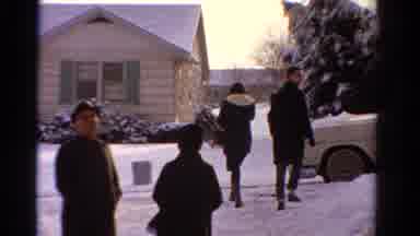 ONTARIO CANADA-1958: A Group Of People Leaving A House In The Winter