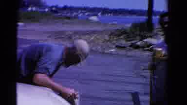 Ontario Canada (1958): Men Unhitch Boat From Car On A Bright Sunny Day