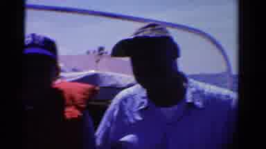 Ontario Canada (1958): Clip Of People On A Boat One Man Waves As They Sail Into