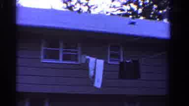 Ontario Canada (1958): A Gray House With A White Roof With A Clothesline With