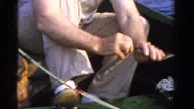 Ontario Canada (1958): A Person Using Angler And Pick The Fishes In The Boat He