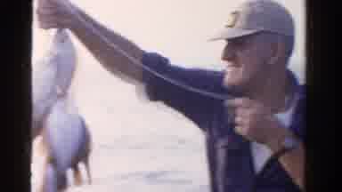 Ontario Canada (1958): Man Proudly Holding Up All The Fish He Caught While