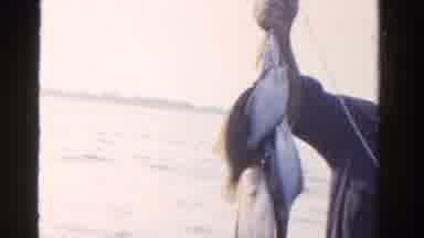 Ontario Canada (1958): Multiple Fishes Are Caught By This Fisherman Wearing Blue