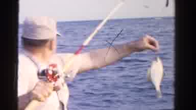 Ontario Canada (1958): Old Guy On The Sea With A Rod Cached A Fish And Being