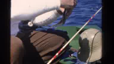 Ontario Canada (1958): Happy Man Fishing In The Sea Taking His Fish From The Hook