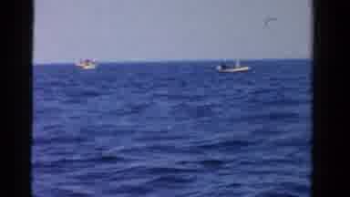 Ontario Canada (1958): Two Boats Floating In The Ocean At Daytime Some Are Fishing