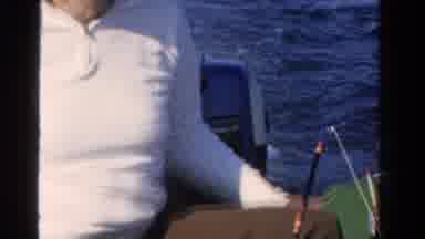 Ontario Canada (1958): Man Wearing White Shirt Sits In Boat On Open Water On A