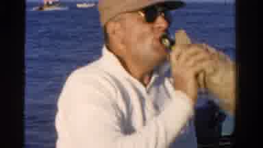 Ontario Canada (1958): Man On A Boat In The Sea Drinking Alcohol Sees Another Boat